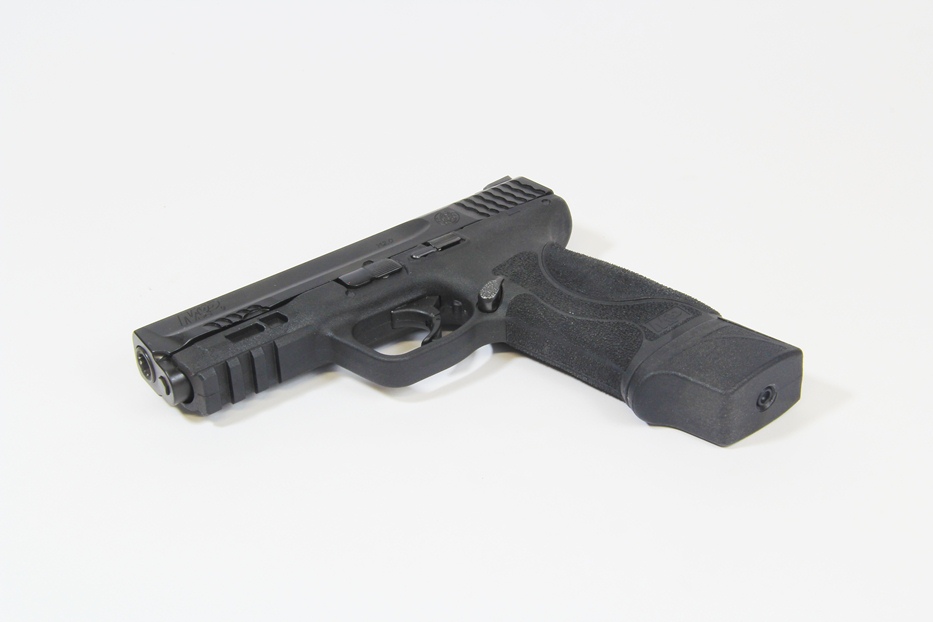 MTX M&P 9 magazine extension in M&P 2.0 pistol laying on table