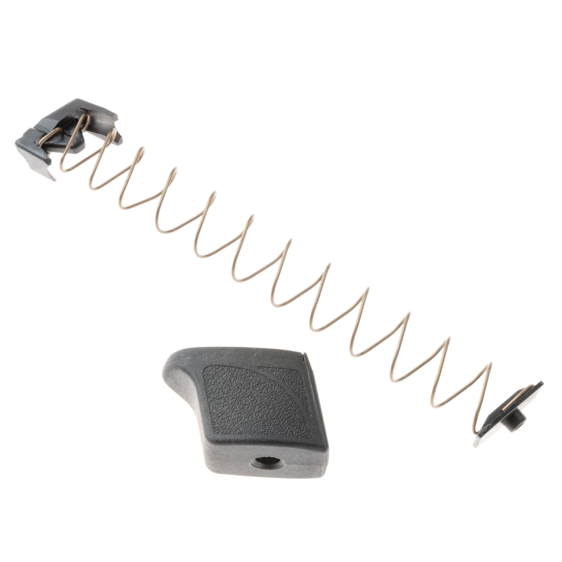 M&P 9 magazine extension kit shown with extension and spring. Extension in black and spring facing left