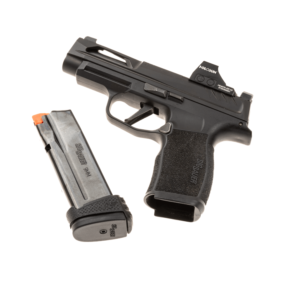 Pistol P365xl with optic shown next to magazine with sleeve adaptor to fill the gap from the longer magazine.